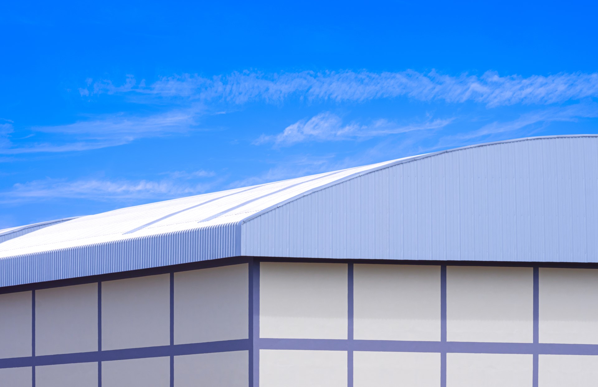 Sloped commercial roofing for a warehouse.